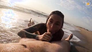 Real couple having fun on a nudist beach. Sexy wet blowjob
